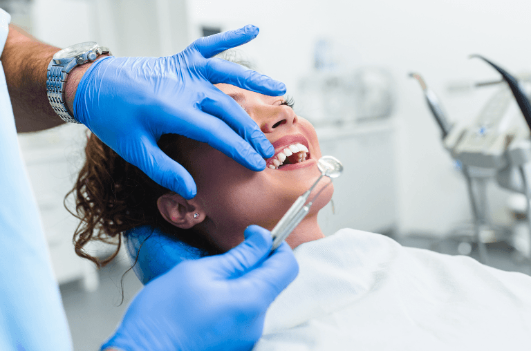 woman getting regular check up at duffield dental care